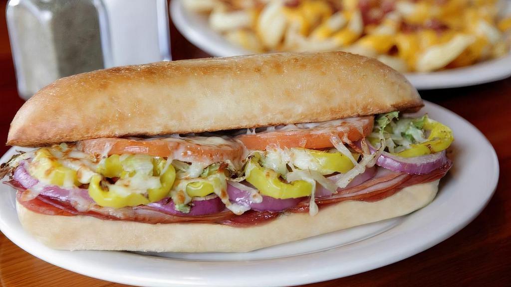 Italian Sub · Pepperoni, salami, smoked ham, garlicbutter, lettuce, tomatoes, red onions,banana peppers, and Italian dressingsmothered with cheese.