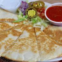 Quesadilla · Mozzarella, provolone and cheddar cheeses garnished with shredded lettuce, tomatoes, red oni...