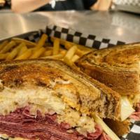 Reuben · Over a half pound of thinly sliced premium corned beef, melted swiss cheese, sauerkraut, tho...