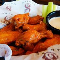 Bone-In Wings · 8 juicy wings fried until crispy, choice of wing sauce, choice of dipping sauce and charred ...
