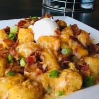 Loaded Spuds · Choice of seasoned waffle fries, beer battered fries, or tater tots. Covered in melted jack-...