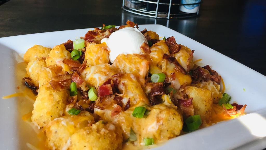 Loaded Spuds · Shredded cheese, Bacon, sour cream, scallions pick waffle fries, French fries, or tater tots. Choose dipper.