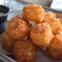 Fried Pepper Jack Bites · Hand breaded and fried pepper jack cheese cubes. Choice of dipper. We think chipotle ranch o...