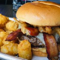 Saints Burger · 8 oz beef patty, pepper-jack cheese, bacon, onion tanglers, BBQ sauce, brioche bun. Our sign...