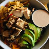 Southwest Chicken Salad · Mixed greens, avocado, tomatoes, black beans, onions, corn, jack-cheddar, tortilla strips, c...