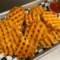 Seasoned Waffle Fries · served with ketchup
