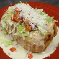 Chimichanga · An extra-large flour tortilla deep-fried and filled with your choice of meat, rice, beans, a...