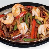 Fajitas · Your choice of chicken, steak, shrimps or mixed, cooked with bell peppers, and onions. Serve...