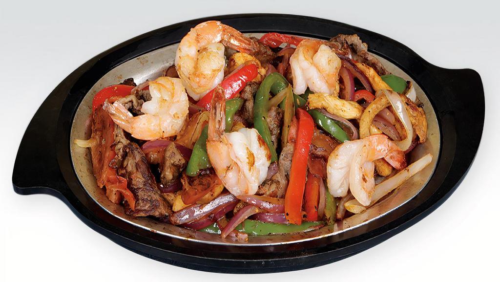 Fajitas · Your choice of chicken, steak, shrimps or mixed, cooked with bell peppers, and onions. Served with a side of rice, beans, and salad.