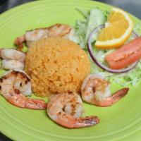 Arroz Con Camarones · Six grilled shrimps served with fried rice.