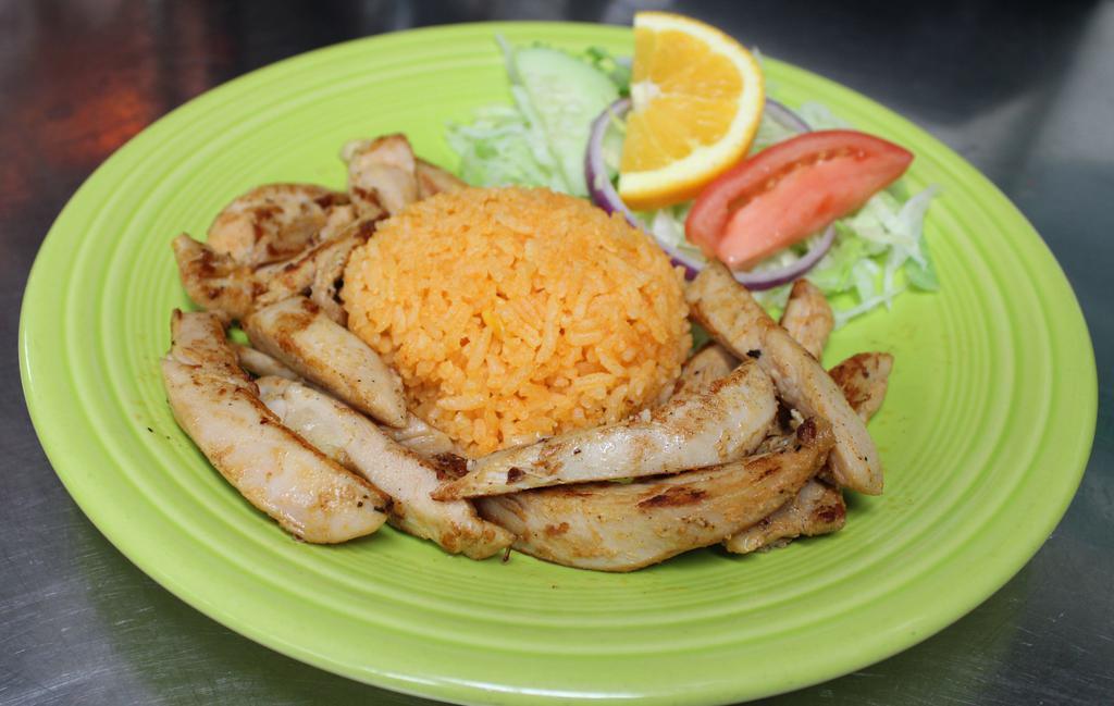 Arroz Con Pollo · Grilled chicken strips served with rice.