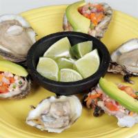 Ostiones Con Ceviche · Fresh half oyster topped with shrimp and fish ceviche and slices of avocado. Consuming raw o...