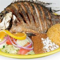 Mojarra Frita · Whole tilapia deep-fried fish. Also can be served with our spicy or garlic sauce.