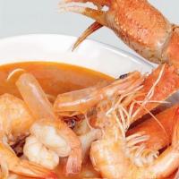 Caldo De Mariscos · Seafood soup with a mix of shrimp, tilapia fish fillet, clams, mussels, scallops, squid, and...