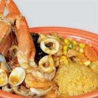 Charola De Mariscos · A mix of tilapia fish fillet, clams, mussels, shrimp, octopus, vegetables, and crab legs sau...