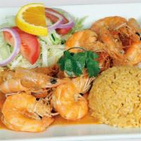 Camarones Al Tequila · Jumbo non-peeled head-on shrimps cooked in our special sauce and a shot of tequila. Served w...