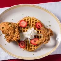 Chicken & Waffles · 2 pcs of chicken cooked to perfection sitting on a buttermilk waffle