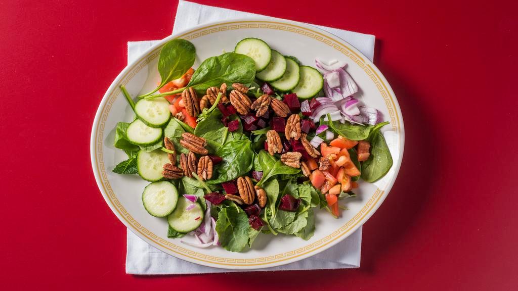 Power Green Salad · Kale, spinach, cucumbers, tomato, green peppers, beets, red onions and mixed nuts.