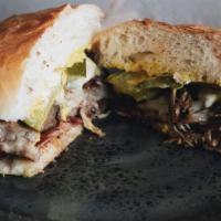 Cubano · Pulled pork, mustard and mayo, ham and pickle, Swiss cheese.