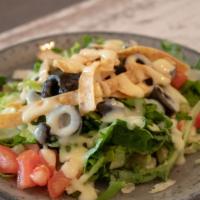 Mini Salad · Romaine lettuce, tomatoes, black olives and tortilla strips topped in our house apple cream ...