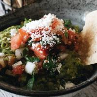 Guacamole Fresco · Made daily with fresh avocados, chopped cilantro, diced tomatoes and onions. Topped with que...