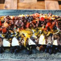 Ranchero Burrito · Asada steak, black beans, chorizo, cheese, pico de gallo, sour cream.