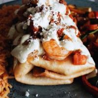 Campeche · Chicken or steak filled topped with jalapeno cream sauce, chorizo-sofrito shrimp and queso f...