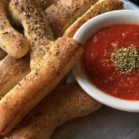 Garlic Sticks · Vegetarian. Our aged pizza dough is baked, brushed with garlic butter, sprinkled with Italia...