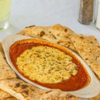 Baked Goat Cheese · Vegetarian. A generous chunk of goat cheese is baked in our house marinara sauce. Served wit...