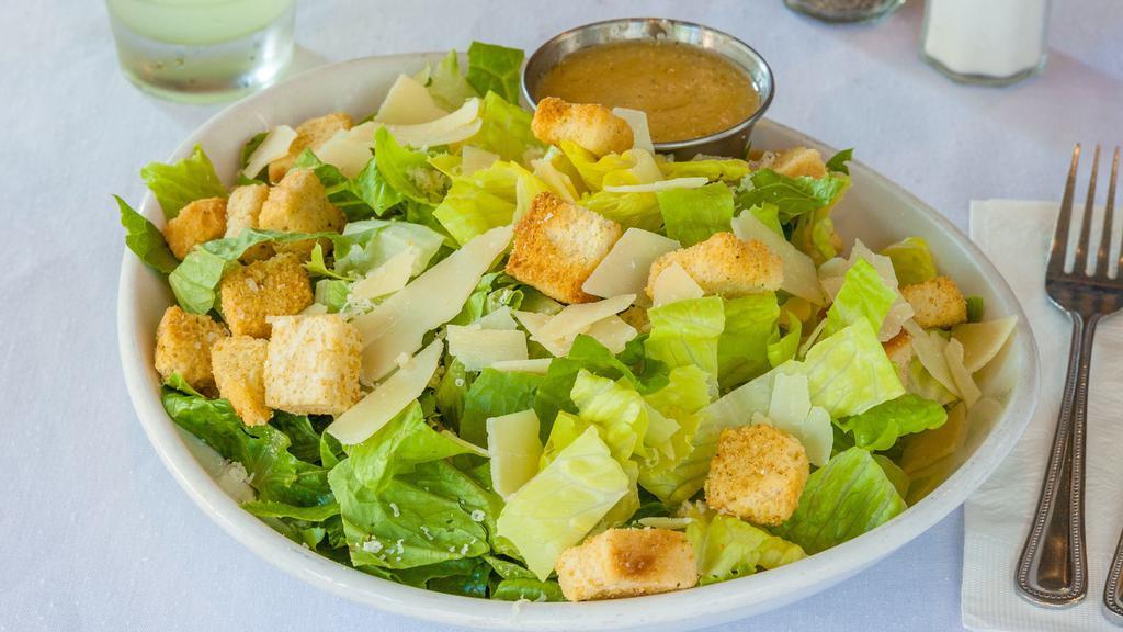 Caesar Salad · Fresh-cut romaine, shaved parmesan, croutons and caesar dressing. Add chicken for an additional charge.