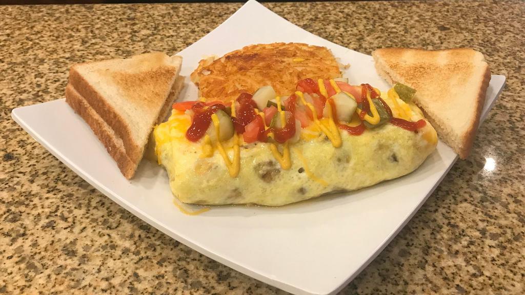 Bacon Cheeseburger Omelette · Black angus beef, bacon, tomato, onion, topped with pickles, ketchup, and mustard.  Served with hash browns and toast