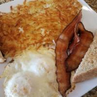 Simple & Quick · Two eggs, two bacon or sausage (links or patties), hash browns, and toast.