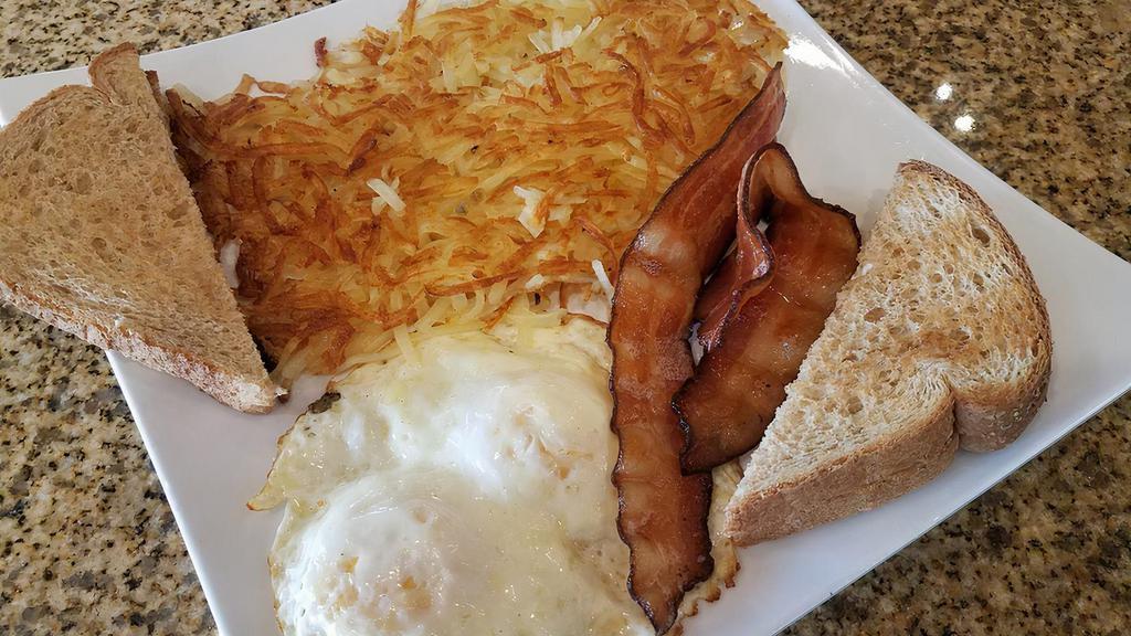 Simple & Quick · Two eggs, two bacon or sausage (links or patties), hash browns, and toast.