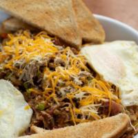 Pig And Pepper Skillet · Pulled pork, bacon, sausage, peppers, onions, cheese over diced potatoes served with two egg...