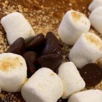 Smores Hotcakes · Two hotcakes filled with chocolate chips and topped with mini marshmallows and crushed graha...