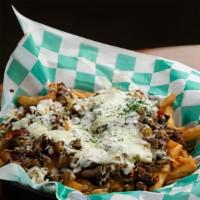 Loaded Philly Fries · Fries smothered in cheese sauce, topped with philly steak, peppers, onions, and mozzarella c...