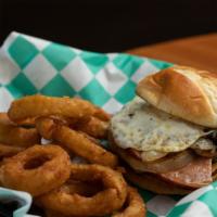Royal Melt · Grilled black Angus beef patty finished with a seasoned fried egg, ham slice, caramelized on...