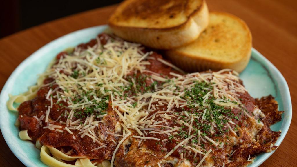 Chicken Parmesan · Fried chicken breast smothered in marinara and parmesan cheese. Served with pasta.