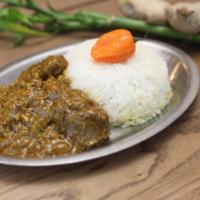 Soupkanja · Okra stew with lamb and smoke fish served with white rice.