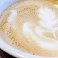 Cappuccino · 2 oz of espresso and 4 oz of steamed milk