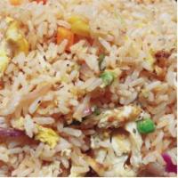 Vegetable Fried Rice · Cooked rice stir-fried in a frying pan mixed with vegetables
