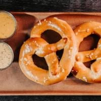 Milwaukee Pretzel · Two locally made pretzels with beer cheese & dijonnaise dipping sauces.