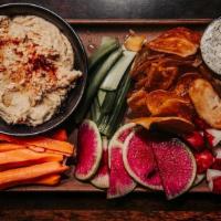 Hummus Duo · House made classic and chipotle hummus, pickled veggies, seasonal veggie medley, and toasted...