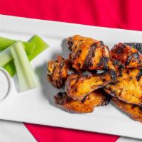 Wings · Slow-cooked, fried & finished on the grill, choice of sauce – mild, medium, tough guy hot, h...