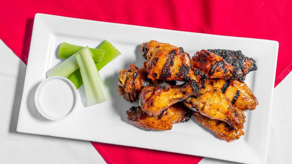 Wings · Slow-cooked, fried & finished on the grill, choice of sauce – mild, medium, tough guy hot, honey sriracha, honey bourbon BBQ, Thai chili, mango habanero, garlic parmesan or pineapple teriyaki, choice of ranch or blue cheese dressing