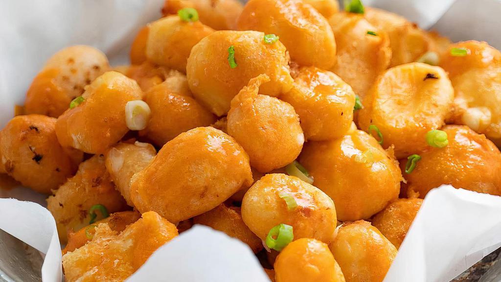 Cheese Curds · Fresh yellow and white fresh cheese curds, beer battered & fried, choice of ranch or buffalo sauce