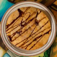 Sopapillas · Cinnamon sugar tortilla chips served with vanilla ice cream, drizzled with chocolate sauce, ...