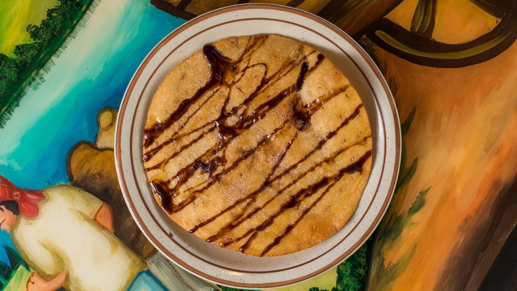 Sopapillas · Cinnamon sugar tortilla chips served with vanilla ice cream, drizzled with chocolate sauce, topped with whipped cream and a cherry.