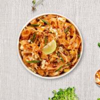 Pad Thai In The Sky · Rice noodle, green onion, tofu, egg, bean sprout, crushed peanut, and sliced lemon.