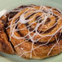 Cinnamon Roll · Butter layered pastry with cinnamon filling, fondant drizzle.